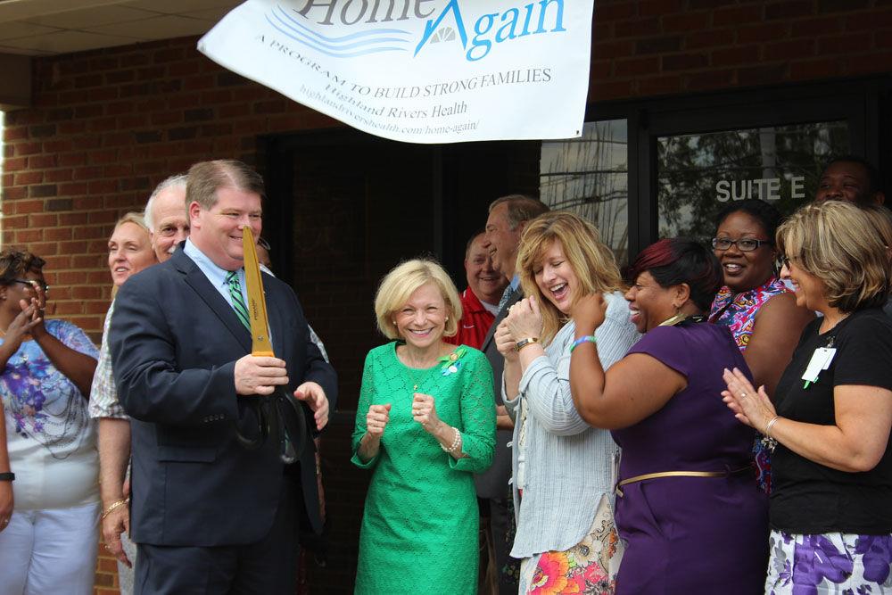 Highland Rivers Health board chair Chief Magistrate Allen Wigington (with scissors, from left), state Rep. Katie Dempsey (R-Rome), Highland Rivers CEO Melanie Dallas and Tawanda Scales with the Georgia Department of Behavioral Health and Developmental Disabilities, celebrate the opening of Highland Rivers’ Home Again office at 1838 Redmond Circle Thursday.