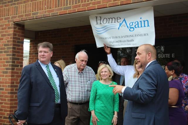 Highland Rivers Health board chair Chief Magistrate Allen Wigington (from left), Floyd County Commissioner Larry Maxey, state Rep. Katie Dempsey (R-Rome), Highland Rivers CEO Melanie Dallas and Michael Mullet, the organization’ community relations director, celebrate the opening of its Home Again program office at 1838 Redmond Circle Thursday.